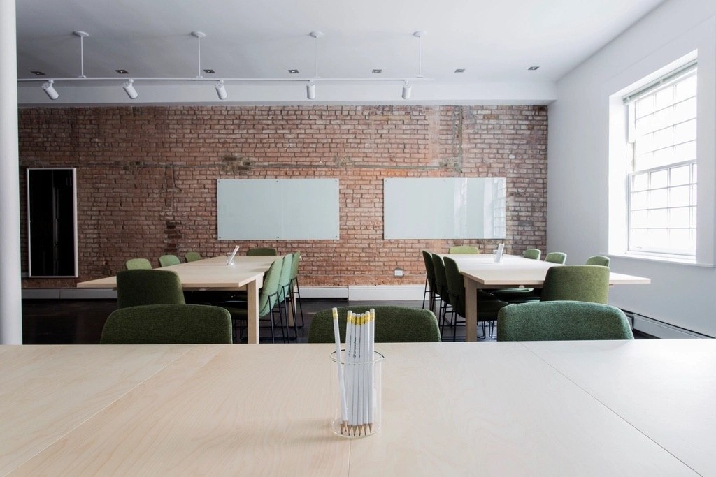 Conference room with exposed brick and large windows