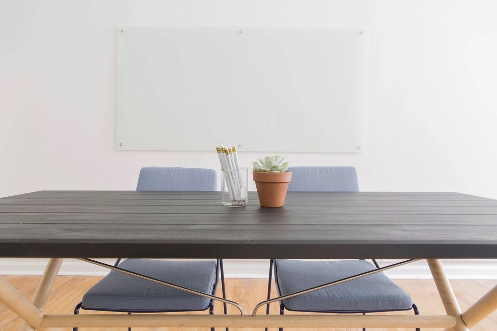 Minimal meeting room with a timber table